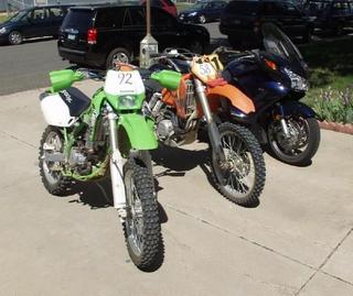2003 Kawasaki KLX300R, 2004 KTM 525 MX, and 2004 Honda ST 1300